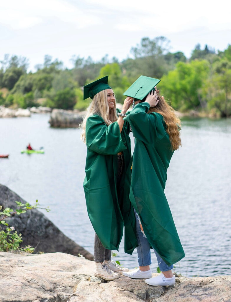 Two girls taking graduation photos
