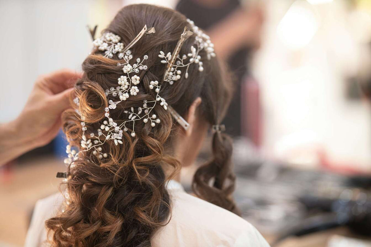 Woman trying on homecoming hair accessories