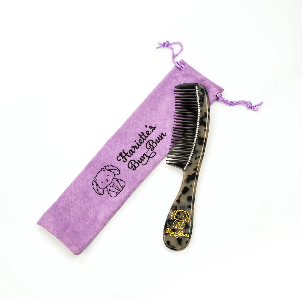 A tortoiseshell fine-toothed comb with a storage bag